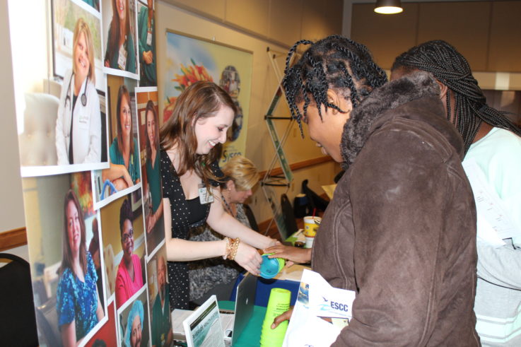 Students looking at Riverside Health Services at ESCC.